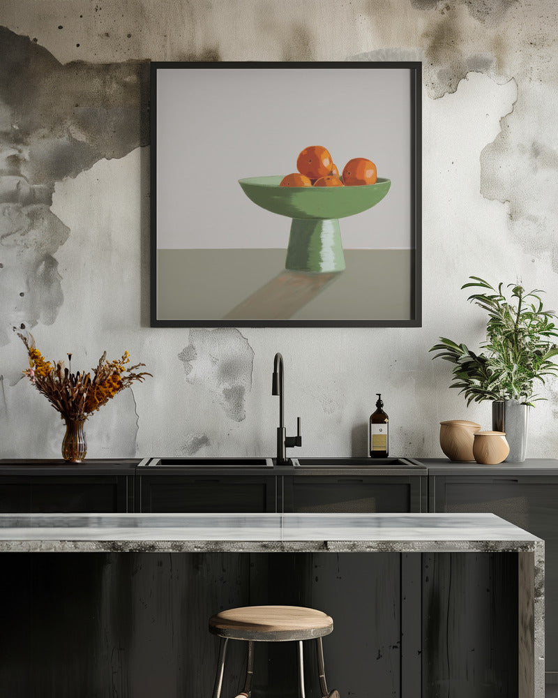 Mandarins in green bowl.