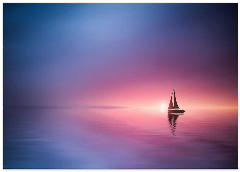 Sailing across the lake toward the sunset