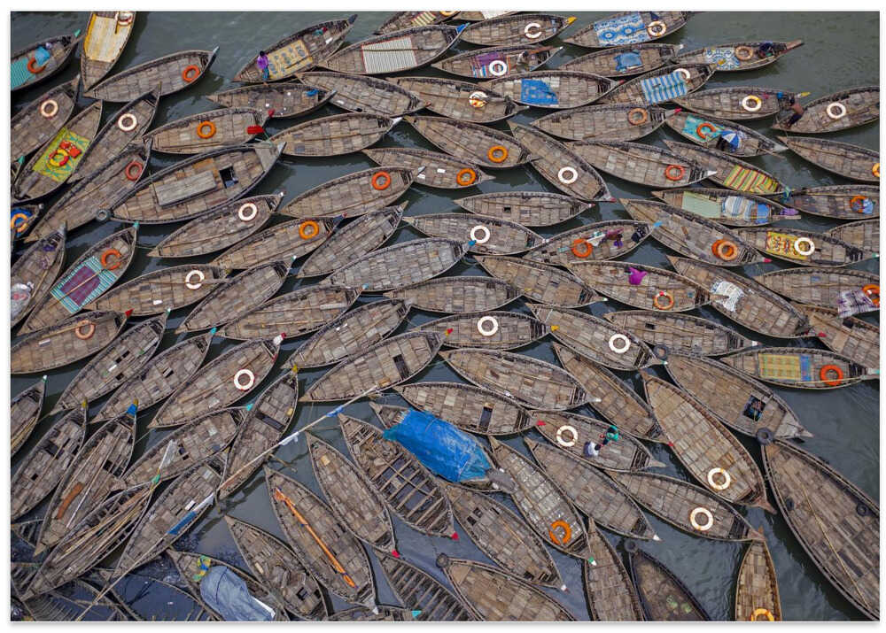Boats laid out like petals with life saving rings
