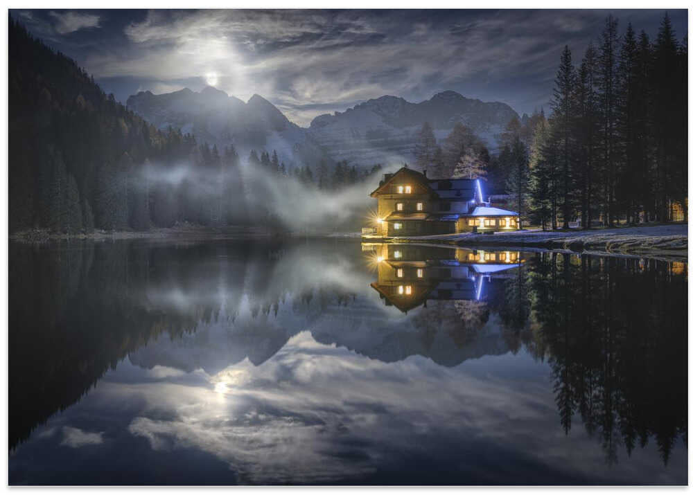 The Moon rises from the mountain