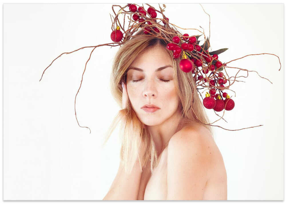 Woman portrait with Christmas wreath on her head