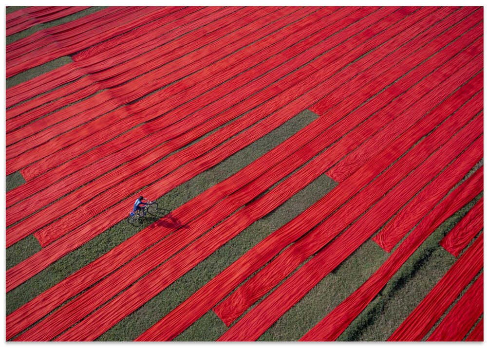 Bicyclist on the red fabrics