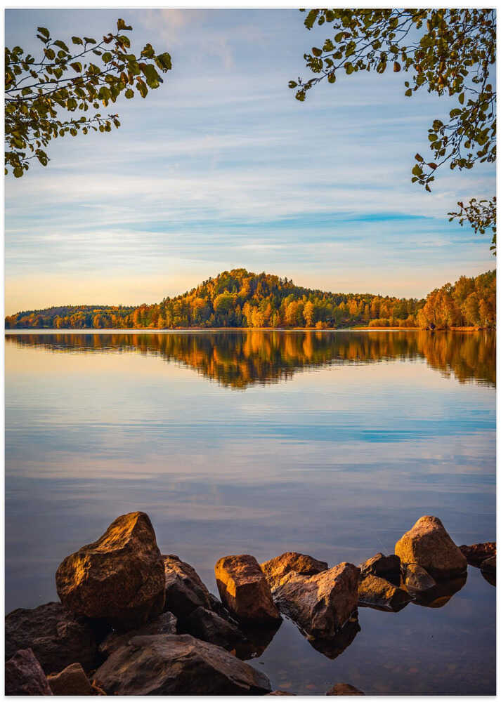 Autumn lake with a small mountain in the background
