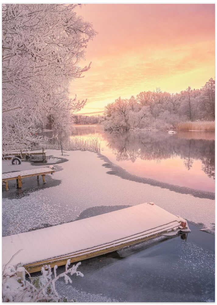 Frozen jetty and pink sunset
