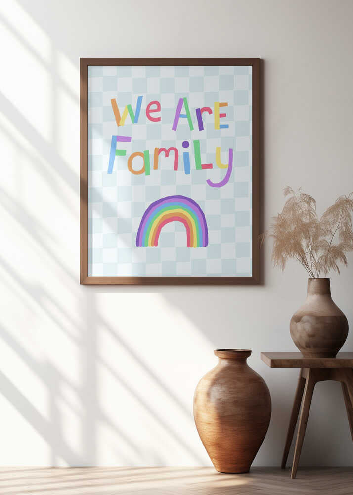 We Are Family in colorful letters above a rainbow