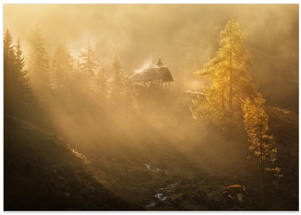 Alpine church in the morning fog