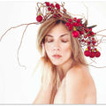 Woman portrait with Christmas wreath on her head