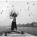 Art Prints of Naga Sadhu posing on boat at varanasi