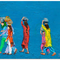 Women Walking With Baskets on Their Heads