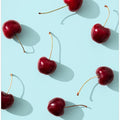 Cherries on turquoise background