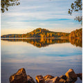 Autumn lake with a small mountain in the background