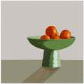 Mandarins in green bowl.